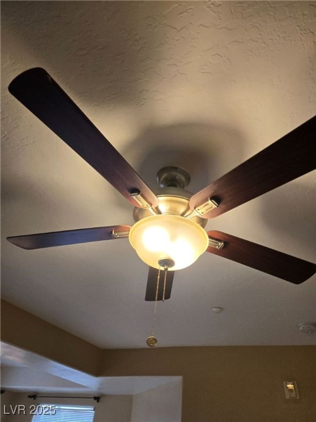 Interior details featuring ceiling fan | Image 11