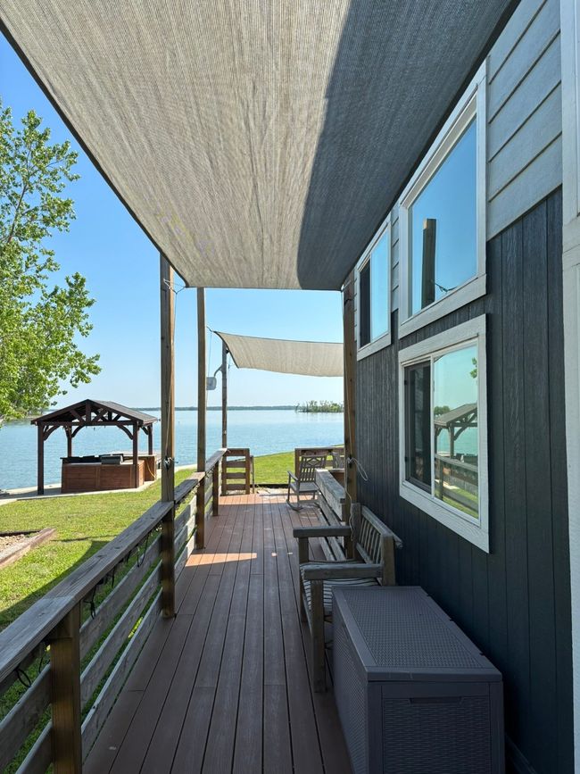 Deck featuring a water view and a gazebo | Image 8