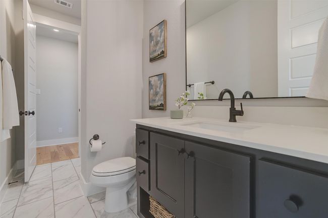 Bathroom featuring vanity and toilet | Image 26