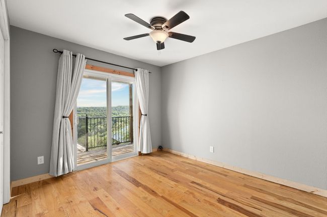 2nd bedroom with sliding doors leading to the balcony | Image 18