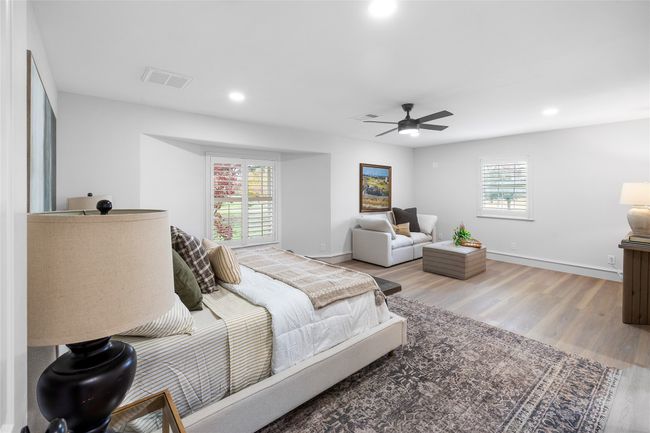 Bedroom with light wood-style floors, recessed lighting, and ceiling fan | Image 29