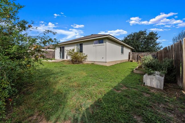 Rear view of house featuring a fenced backyard | Image 23