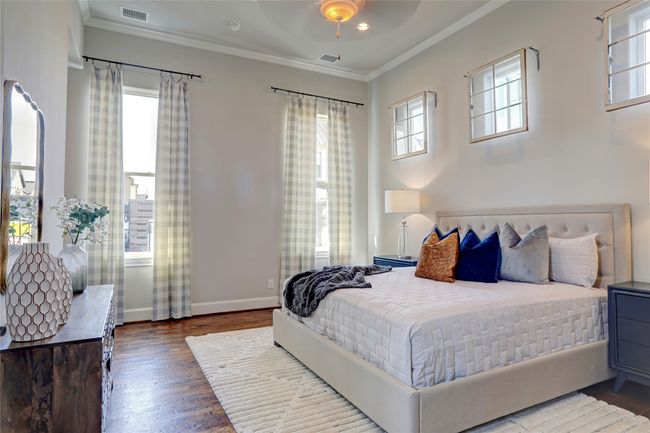 The Primary bedroom with a relaxing view to secret backyard garden. | Image 11