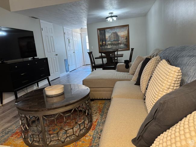 Living area featuring wood finished floors and baseboards | Image 4