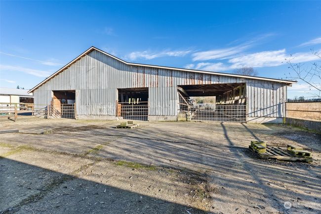 The former dairy barns are impressively large, offering ample space and endless possibilities for customization. Whether you envision repurposing them for storage, livestock, or other projects, these barns provide the flexibility to suit your specific needs | Image 27