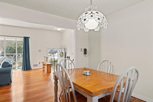 Open, airy Dining room with hardwood floors | Image 7