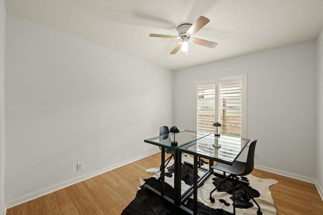 Windows throughout the home are equipped with shutters. | Image 20