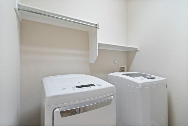 Laundry area with washing machine and clothes dryer and laundry area | Image 32