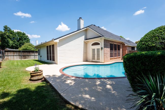 View of swimming pool with a patio area and french doors | Image 10