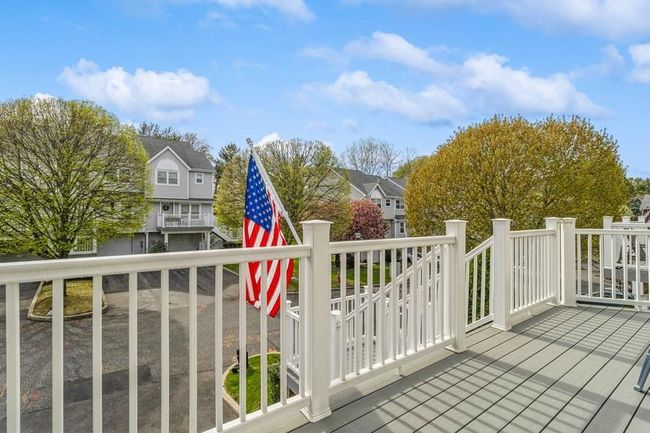 Wooden terrace with a residential view | Image 22