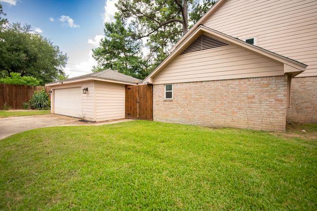 Side of home and garage | Image 50