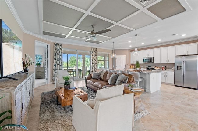 Living room with recessed lighting, ceiling fan, ornamental molding, and coffered ceiling | Image 26