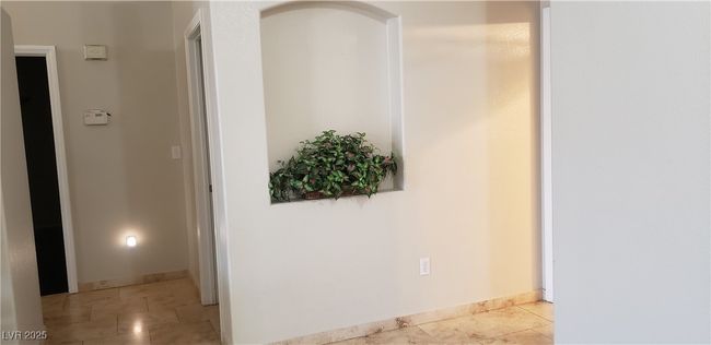 Corridor featuring light tile patterned floors and baseboards | Image 15
