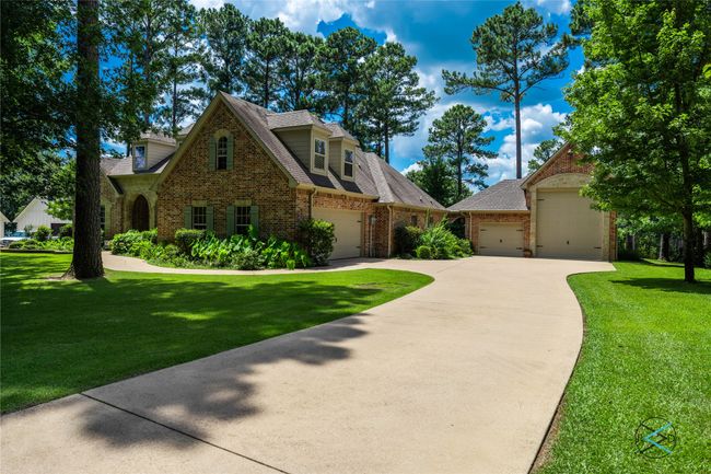 View of front of property with a garage and a front lawn | Image 31