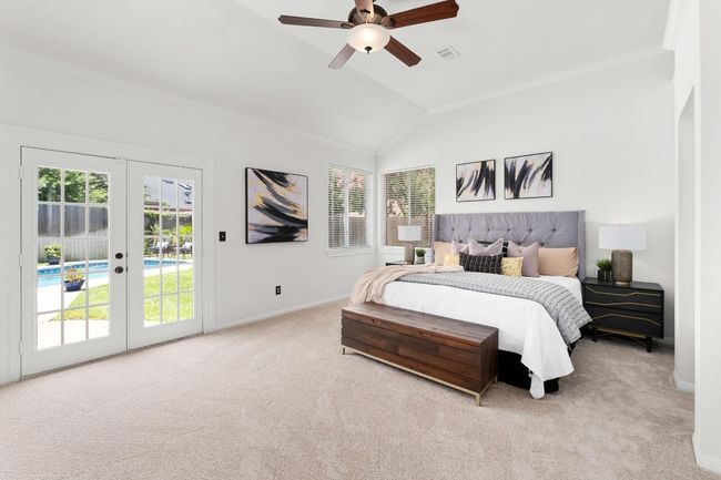 Bedroom with french doors, access to outside, carpet, lofted ceiling, and ornamental molding | Image 14
