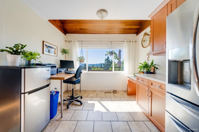Office area featuring light tile patterned floors, wooden ceiling, and baseboards | Image 22