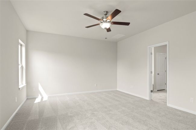 Empty room featuring a ceiling fan and light carpet | Image 20