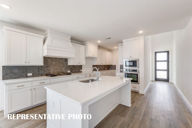 The oversized island is the hub of this fantastic kitchen and the perfect place for friends and family to gather round. REPRESENTATIVE PHOTO | Image 7