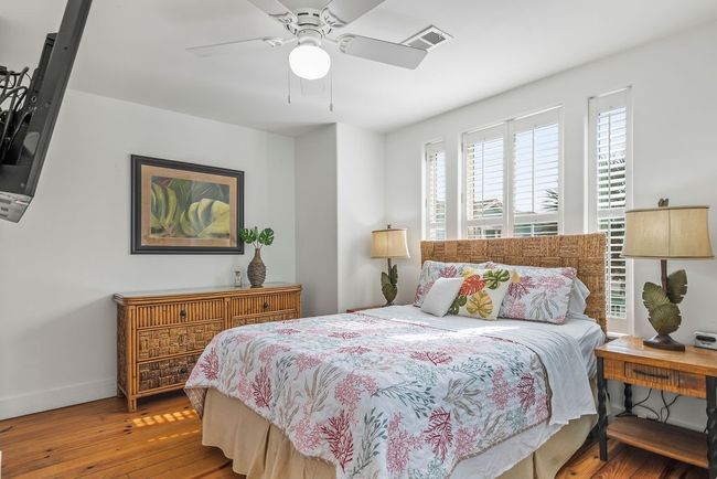 Spacious Primary with lots of natural light, wood floor and plantation shutters | Image 14