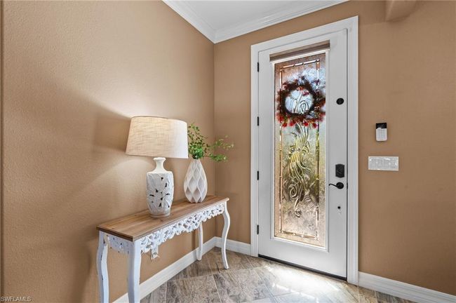 Foyer with baseboards and ornamental molding | Image 12
