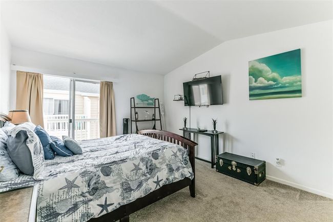 The primary bedroom has its own balcony that faces West. | Image 14