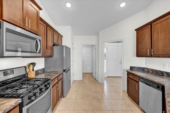 9750 Pepper Tree Pl, House other with 4 bedrooms, 2 bathrooms and null parking in WILDWOOD FL | Image 15
