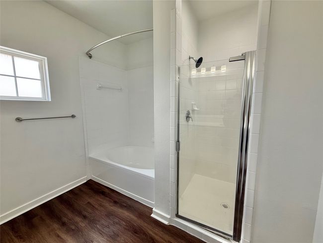 Full bathroom featuring wood finished floors and baseboards | Image 16