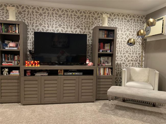 Carpeted living area with ornamental molding | Image 8