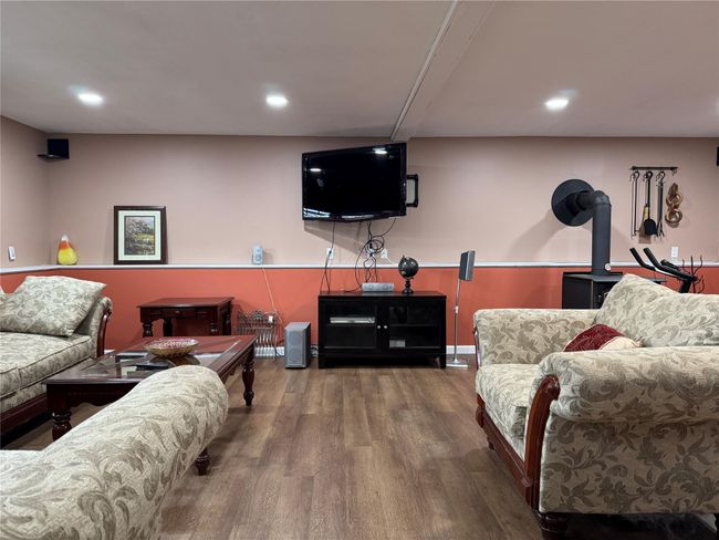 Living room with wood finished floors and recessed lighting | Image 21