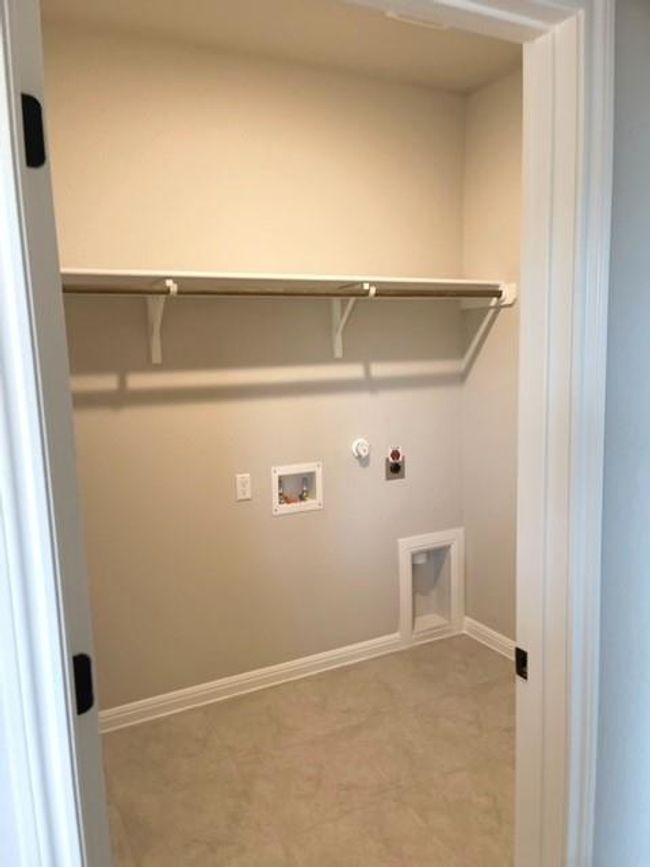 Washroom with hookup for a washing machine, gas dryer hookup, and electric dryer hookup | Image 10