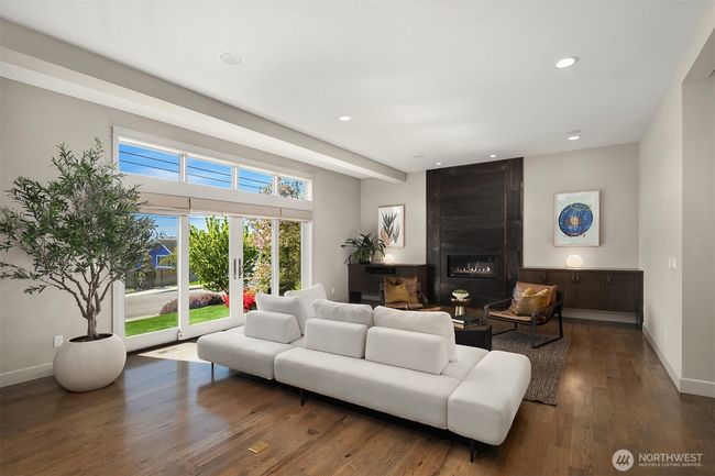 We love this custom metal fireplace. It is a beautiful artisan statement. Wonderful French doors let you enjoy Kirkland's most beloved and friendly street. | Image 6