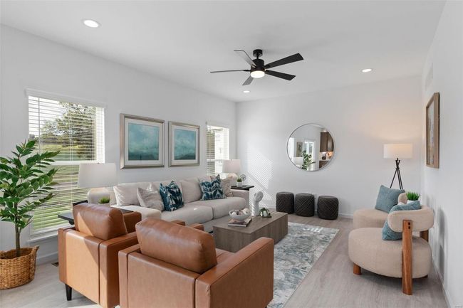 Living room with ceiling fan and light wood-type flooring | Image 7