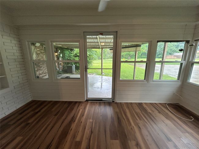 View of unfurnished sunroom | Image 12