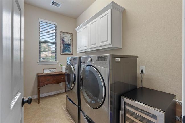 The laundry room with plenty of space for a refrigerator or freezer. | Image 17