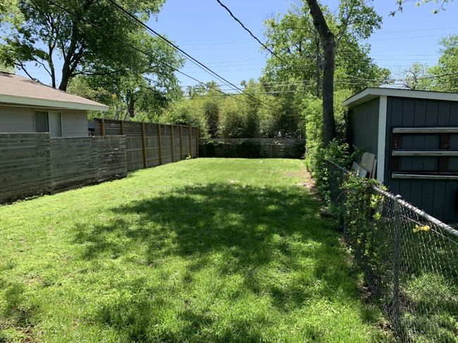 View of the fenced back yard. | Image 16