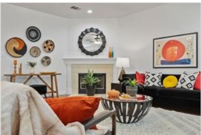 Living area featuring a fireplace, visible vents, and recessed lighting | Image 22