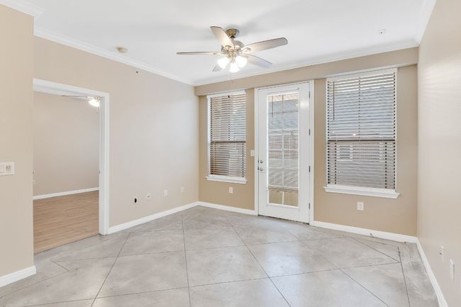 Living room with new ceiling fan, baseboards, and crown molding. All new paint and blinds. | Image 10
