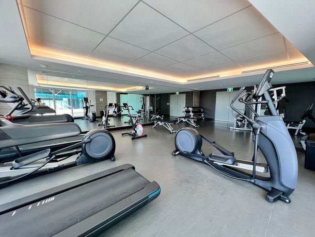 Gym featuring a raised ceiling | Image 19