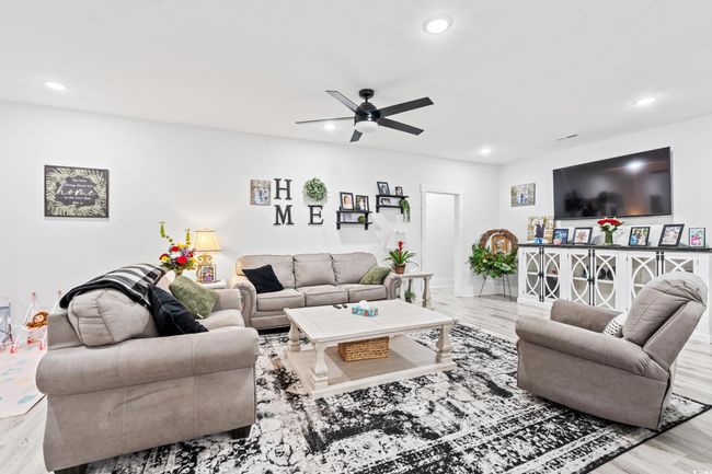Living area featuring recessed lighting, ceiling fan, and wood finished floors | Image 5