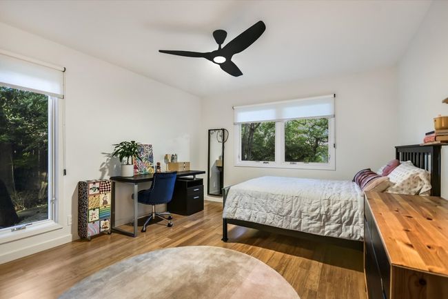 Cozy bedroom with multiple windows | Image 19