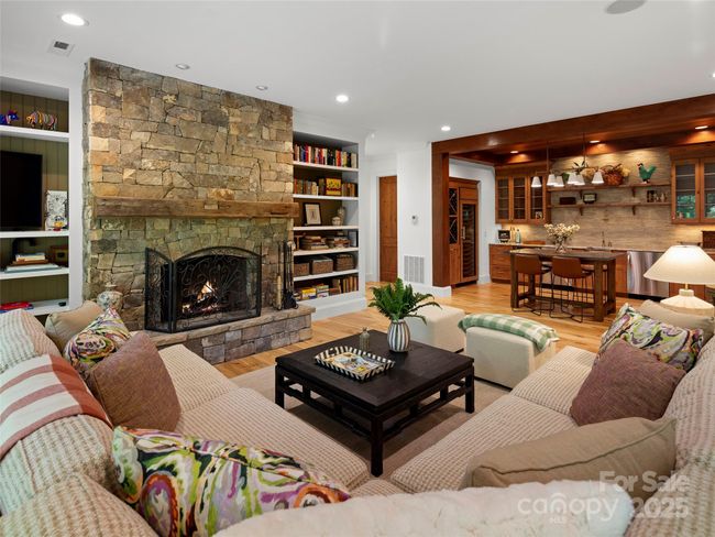 Terrace level living room provides a beautiful area for relaxing and entertaining. | Image 27