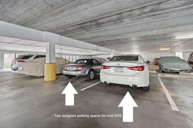 Two assigned parking spaces on main level in secure garage | Image 40