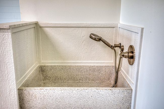 A convenient dog wash station awaits in the attached two-car garage. | Image 31