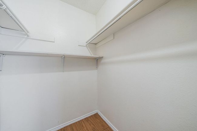 Spacious closet featuring wood finished floors | Image 31