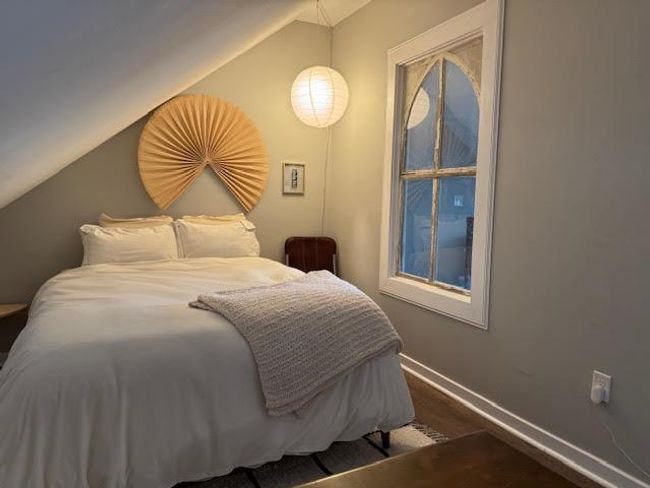 Bedroom with vaulted ceiling and wood finished floors | Image 31