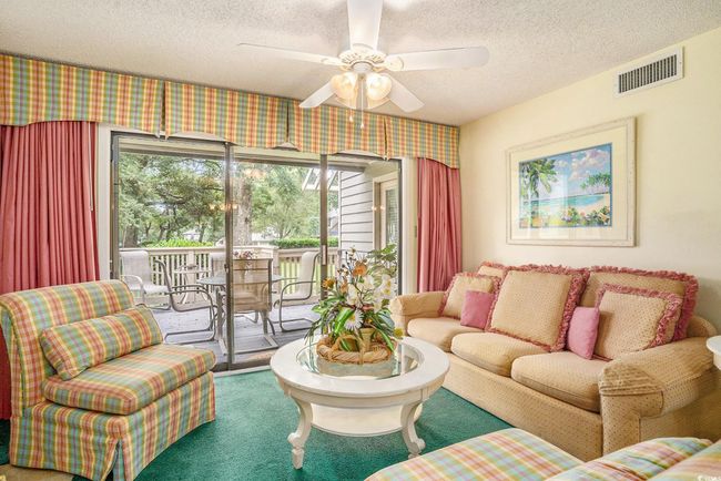 Coloful professionally decorated beach themed condo | Image 4