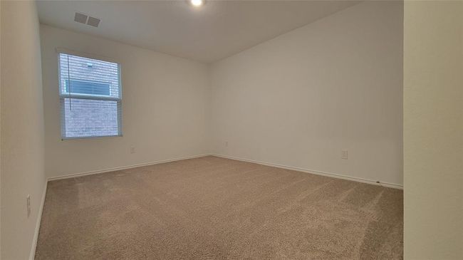 Spare room featuring carpet flooring | Image 15