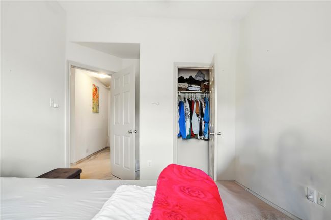 Bedroom featuring light carpet and a closet | Image 28