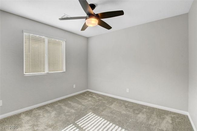 Unfurnished room with carpet flooring, a ceiling fan, and baseboards | Image 34