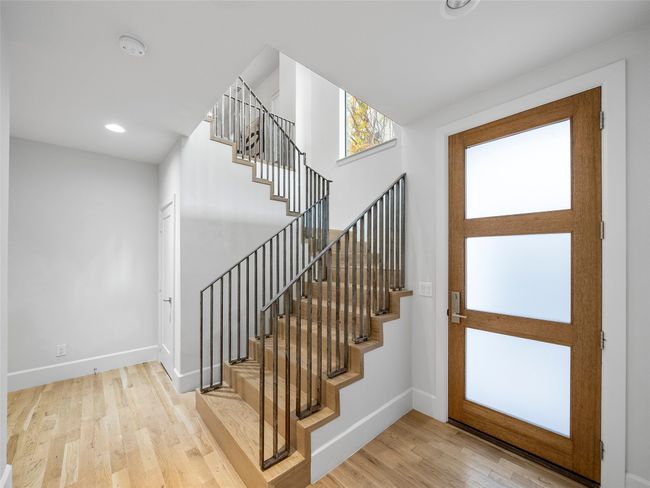 Foyer entrance featuring stairway, wood finished floors, and recessed lighting | Image 8